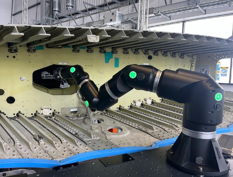 Re-Vector ZH1700 robotic arm in operation on an aircraft wing.